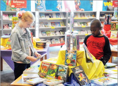 Perusing the reading material at the MES Book Fair