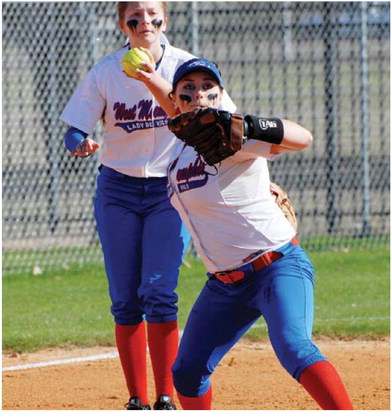 Lady Devil softball in action