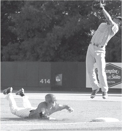 Nick Alsbrook skies to try to field a throw during action last night. Bryce Logan scores a run last night.