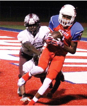 Collin Chambers (2) hauls in a touchdown pass against  Blytheville last fall.