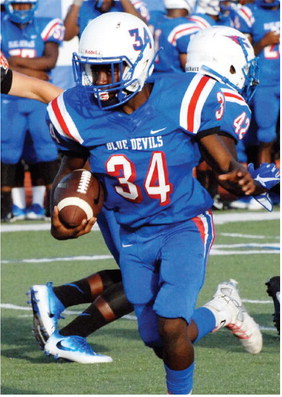 Jarricus Robinson (34) cuts upfield against Batesville.