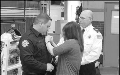 Chief Wayne Gately looked on as London Bullard received his paramedic pins.